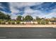 Community tennis court with fencing and lush landscaping. Sign reads 'Members Only' at 7807 E Granada Rd, Scottsdale, AZ 85257