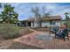 Outdoor living space with patio, brick fire pit, and comfortable seating at 815 E Paradise Ln, Phoenix, AZ 85022