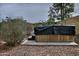 Backyard featuring a covered hot tub surrounded by rock landscaping and greenery at 815 E Paradise Ln, Phoenix, AZ 85022