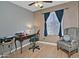 Bedroom with desk area and comfortable chair at 815 E Paradise Ln, Phoenix, AZ 85022