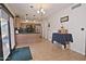 Bright eat-in kitchen with stainless steel appliances, hardwood floors, and sliding glass doors to backyard at 815 E Paradise Ln, Phoenix, AZ 85022