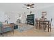 Open-concept living room and dining area with wood-look floors and plenty of natural light at 815 E Paradise Ln, Phoenix, AZ 85022