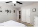 This bedroom offers carpeted floors, a ceiling fan, and closet with sliding doors at 8402 W Laurel Ln, Peoria, AZ 85345