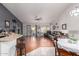 Open living room featuring tile and wood floors, modern decor and slider to backyard at 8402 W Laurel Ln, Peoria, AZ 85345
