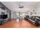 Bright and airy living room featuring modern decor, wood floors, and a sliding glass door at 8402 W Laurel Ln, Peoria, AZ 85345