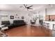 Spacious living room area with modern decor, hardwood floors, and an open floor plan at 8402 W Laurel Ln, Peoria, AZ 85345
