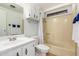 Bathroom with a shower-tub combo, white vanity, and mirrored cabinet at 9333 E University Dr # 113, Mesa, AZ 85207