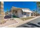 Inviting exterior featuring a covered entrance, well-kept yard, and a ramp for accessibility at 9333 E University Dr # 113, Mesa, AZ 85207