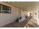 Charming exterior showcasing a covered patio area and well-maintained landscaping at 9333 E University Dr # 113, Mesa, AZ 85207