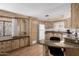 Bright kitchen featuring wood cabinets, modern appliances, and a center island with a granite countertop at 9333 E University Dr # 113, Mesa, AZ 85207