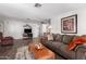 Open floor plan living room featuring hardwood floors, comfortable seating, and entertainment center at 9333 E University Dr # 113, Mesa, AZ 85207