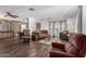 Open floor plan living area featuring hardwood floors, neutral color scheme and comfortable seating at 9333 E University Dr # 113, Mesa, AZ 85207