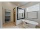Bathroom with a soaking tub, large mirror, tile flooring, and walk-in shower, a luxurious retreat at 9442 N 118Th St, Scottsdale, AZ 85259