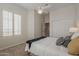 Carpeted Bedroom features shutters, closet, lamps, ceiling fan and cozy decor at 9442 N 118Th St, Scottsdale, AZ 85259