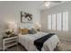 Bedroom features shutters, lamps, wall art, and ceiling fan over carpeted floor at 9442 N 118Th St, Scottsdale, AZ 85259
