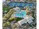 Aerial view of community amenities including tennis courts, a pool, and clubhouse surrounded by lush landscaping at 9442 N 118Th St, Scottsdale, AZ 85259