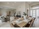 Bright dining room featuring a wooden table with seating for six and open layout at 9442 N 118Th St, Scottsdale, AZ 85259