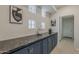 Hallway features decorative lighting and stone countertops at 9442 N 118Th St, Scottsdale, AZ 85259