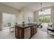 Open concept kitchen with island, dishwasher, and eat in kitchen with outdoor views at 9442 N 118Th St, Scottsdale, AZ 85259