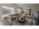 Bright and spacious living room featuring contemporary decor, comfortable seating, and lots of natural light at 9442 N 118Th St, Scottsdale, AZ 85259