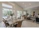 Bright, open living and dining room with access to the beautiful backyard and pool area at 9442 N 118Th St, Scottsdale, AZ 85259