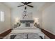 A beautiful primary bedroom featuring a ceiling fan, accent pillows, and matching nightstands at 9442 N 118Th St, Scottsdale, AZ 85259