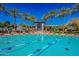 Community pool with lap lanes is lined with palm trees and has views of the clubhouse at 9442 N 118Th St, Scottsdale, AZ 85259