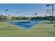 Well-maintained community tennis courts with green and blue surfacing and manicured landscaping at 9442 N 118Th St, Scottsdale, AZ 85259