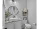 Stylish bathroom with granite countertop, vessel sink, modern mirror, decor, and toilet at 9942 E Rotation Dr, Mesa, AZ 85212