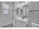 Bright bathroom features a white vanity with sink, toilet and towel rack at 9942 E Rotation Dr, Mesa, AZ 85212
