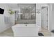 Bright bathroom with modern tub, spacious shower, and stylish decor for relaxation and unwinding at 9942 E Rotation Dr, Mesa, AZ 85212