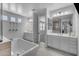 Bright bathroom featuring dual sinks, modern fixtures, bathtub, and generous counter space at 9942 E Rotation Dr, Mesa, AZ 85212