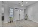Welcoming foyer with wood-look tile flooring, a stylish rug, and a double-door entryway at 9942 E Rotation Dr, Mesa, AZ 85212