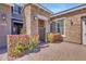 Attractive stone archway with an iron gate provides a lovely entrance to the home at 9942 E Rotation Dr, Mesa, AZ 85212