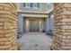 This front yard features a brick paved courtyard with an iron door at 9942 E Rotation Dr, Mesa, AZ 85212