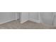 Upstairs hallway with neutral carpet and white trim at 9942 E Rotation Dr, Mesa, AZ 85212