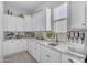 This kitchen has ample white countertops and cabinets along with a stainless-steel soda machine at 9942 E Rotation Dr, Mesa, AZ 85212