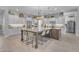 Bright, open kitchen features a large center island with marble countertops and seating at 9942 E Rotation Dr, Mesa, AZ 85212