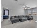 Spacious living room featuring a plush sectional sofa and plenty of room for relaxation at 9942 E Rotation Dr, Mesa, AZ 85212