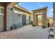 Comfortable courtyard features brick pavers, bench seating, and a decorative stone entrance at 9942 E Rotation Dr, Mesa, AZ 85212