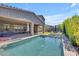 Backyard featuring a pool, patio, and covered seating area for entertaining guests at 9942 E Rotation Dr, Mesa, AZ 85212