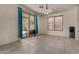 Well-lit dining area with large sliding doors, tile flooring, a modern chandelier, and access to the backyard patio at 1101 S Hazel St, Gilbert, AZ 85296