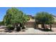 Charming two-story home with a two-car garage, well-maintained landscaping, and mature trees in a residential neighborhood at 1101 S Hazel St, Gilbert, AZ 85296