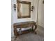 Elegant hallway table with decorative mirror and sconces at 1101 S Hazel St, Gilbert, AZ 85296