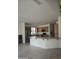 Open kitchen boasts stainless appliances, wooden cabinetry and large breakfast bar at 1101 S Hazel St, Gilbert, AZ 85296
