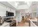 Modern kitchen with stainless steel appliances, white cabinets, and adjacent dining area for easy living at 1211 N Miller Rd # 129, Scottsdale, AZ 85257