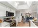 Bright kitchen featuring stainless steel appliances, white cabinetry, and an adjacent dining area with seating for six at 1211 N Miller Rd # 129, Scottsdale, AZ 85257