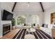 Bright living room with vaulted ceilings, fireplace, and modern decor create a welcoming atmosphere at 1211 N Miller Rd # 129, Scottsdale, AZ 85257