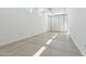 Spacious garage with a roll-up door, recessed lighting, and ample room for multiple vehicles at 19054 W Becker Ln, Surprise, AZ 85388