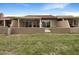 Private backyard area with patio, lawn and fencing at 10014 E Michigan Ave, Sun Lakes, AZ 85248